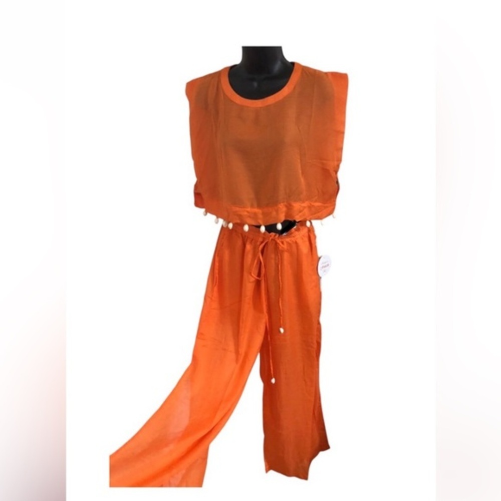Orange 2 piece sheer cowrie shell adorned crop top and split leg pants beach set